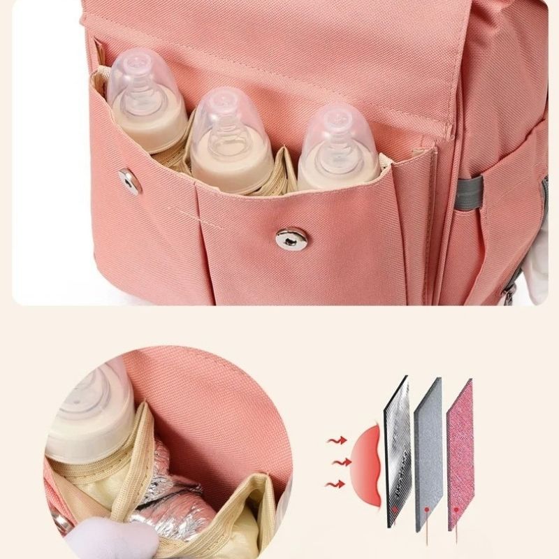 sac à langer à dos rose avec trois compartiments thermiques pour biberons