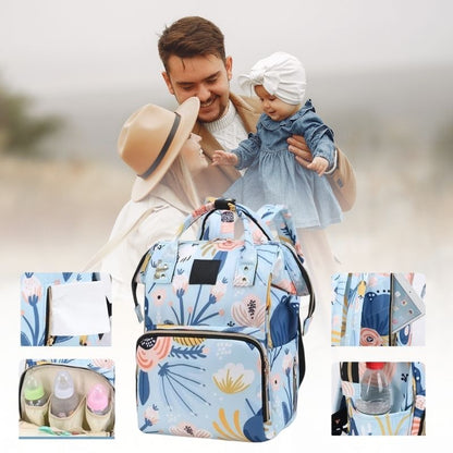 Sac à langer à dos floral avec plusieurs pochettes extérieures pour lingettes, biberon, bouteille et une pochette invisible.