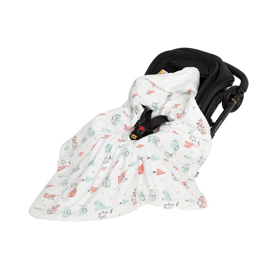 nid d'ange cosy installé dans une siège auto