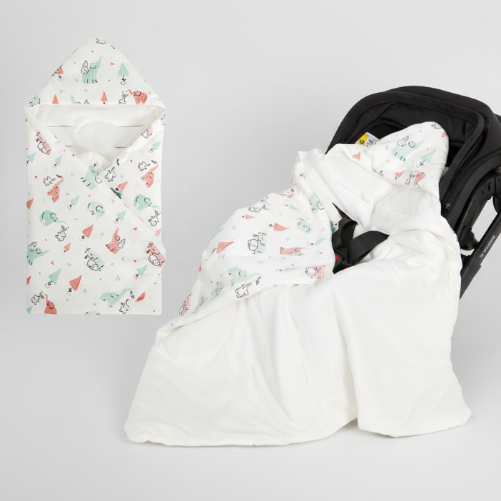 nid d'ange cosy plié et installé dans siège auto