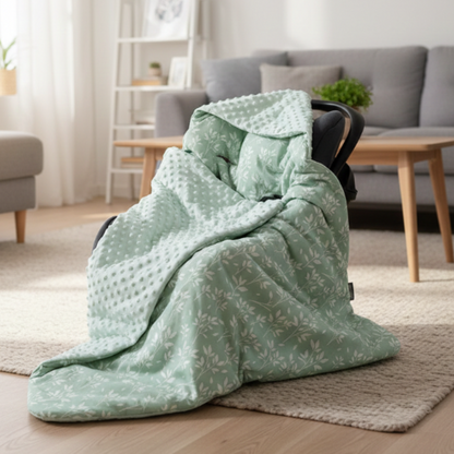 nid d'ange cosy vert installé dans siège auto